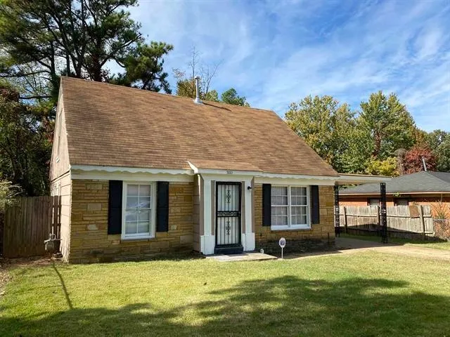 a house that has a big yard in front of it