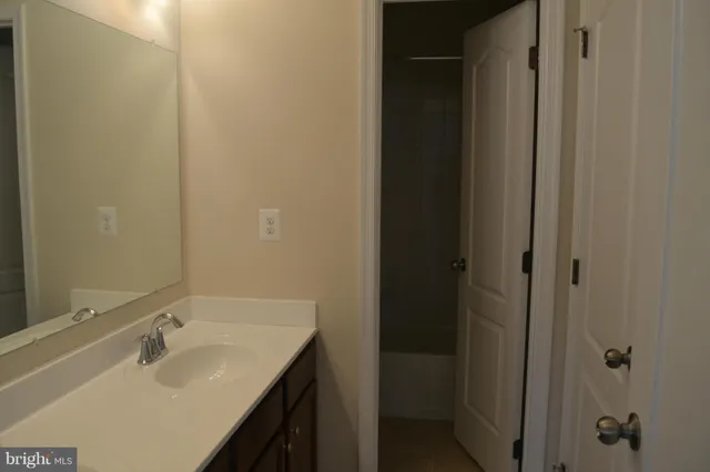 a view of a lake with a house in the background