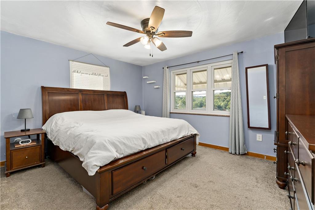 12219 Herold Drive Irwin, PA 15642 - Photo 12 of 28 a bed sitting in a room next to a window