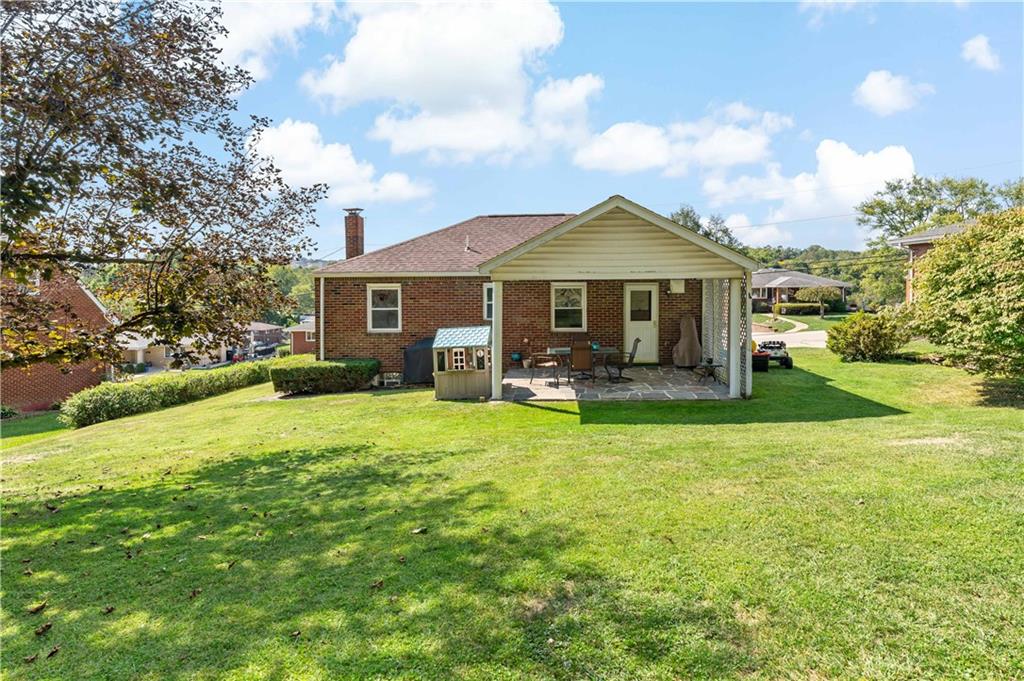 12219 Herold Drive Irwin, PA 15642 - Photo 22 of 28 a front view of a house with garden