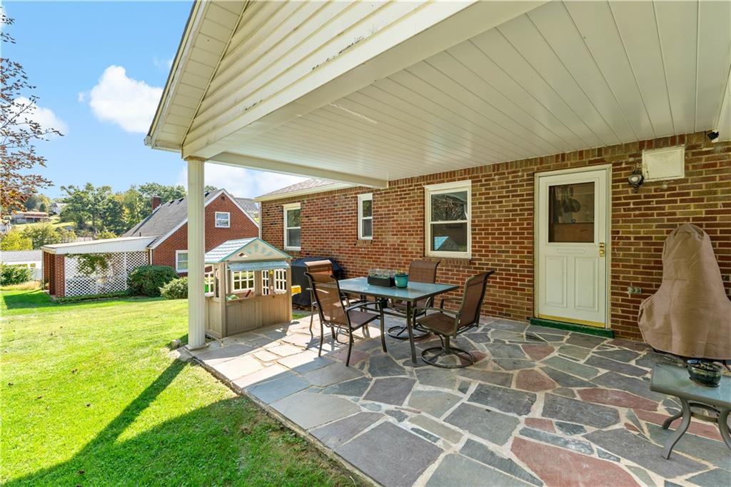 12219 Herold Drive Irwin, PA 15642 - Photo 23 of 28 a view of a house with backyard porch and sitting area