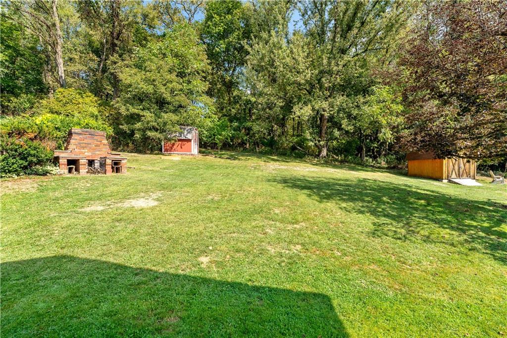 12219 Herold Drive Irwin, PA 15642 - Photo 24 of 28 a backyard of a house with table and chairs