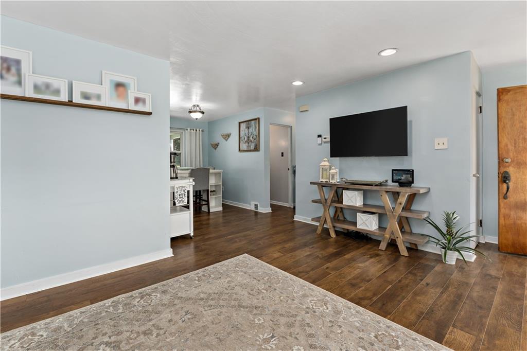12219 Herold Drive Irwin, PA 15642 - Photo 4 of 28 a living room with furniture and a flat screen tv