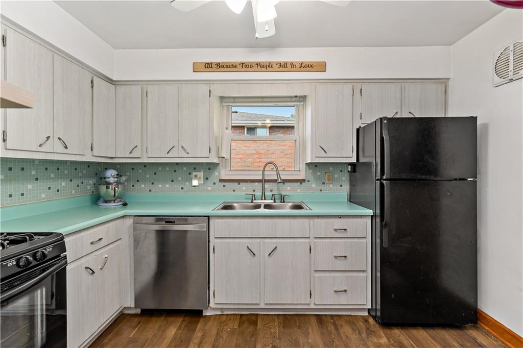 12219 Herold Drive Irwin, PA 15642 - Photo 8 of 28 a kitchen with granite countertop a refrigerator stove and sink