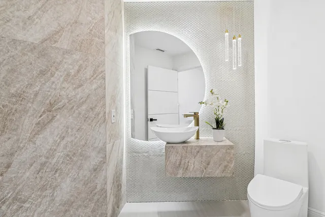 a living room with furniture and a toilet