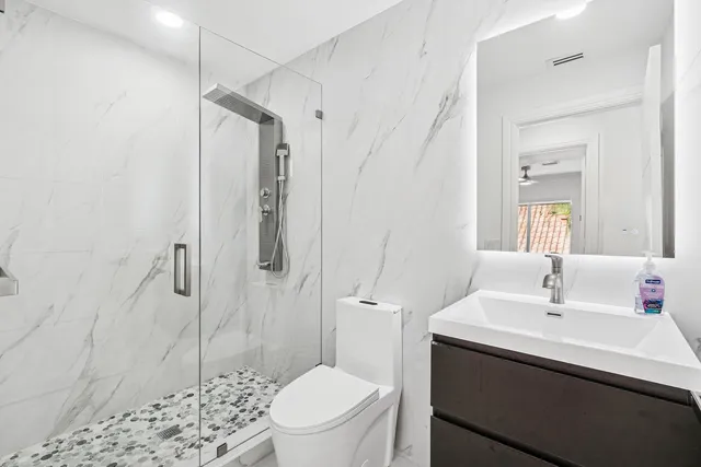 a spacious bedroom with a bed and a window