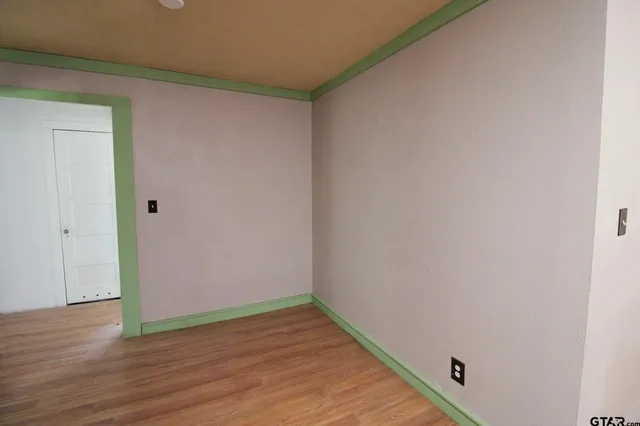 a view of a small space with wooden floor