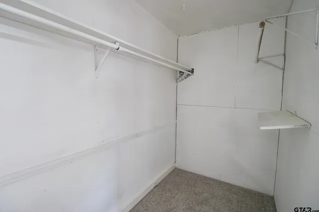 a view of a room with racks on the wall