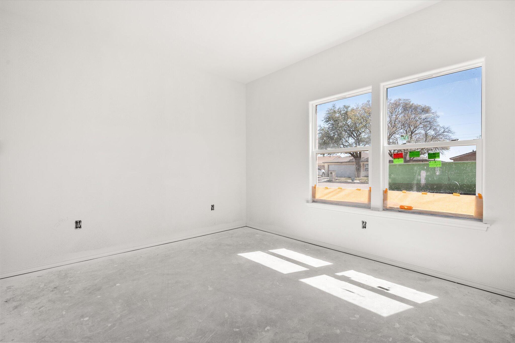 6412 38th Street Lubbock, TX 79407 - Photo 4 of 20 an empty room with a window