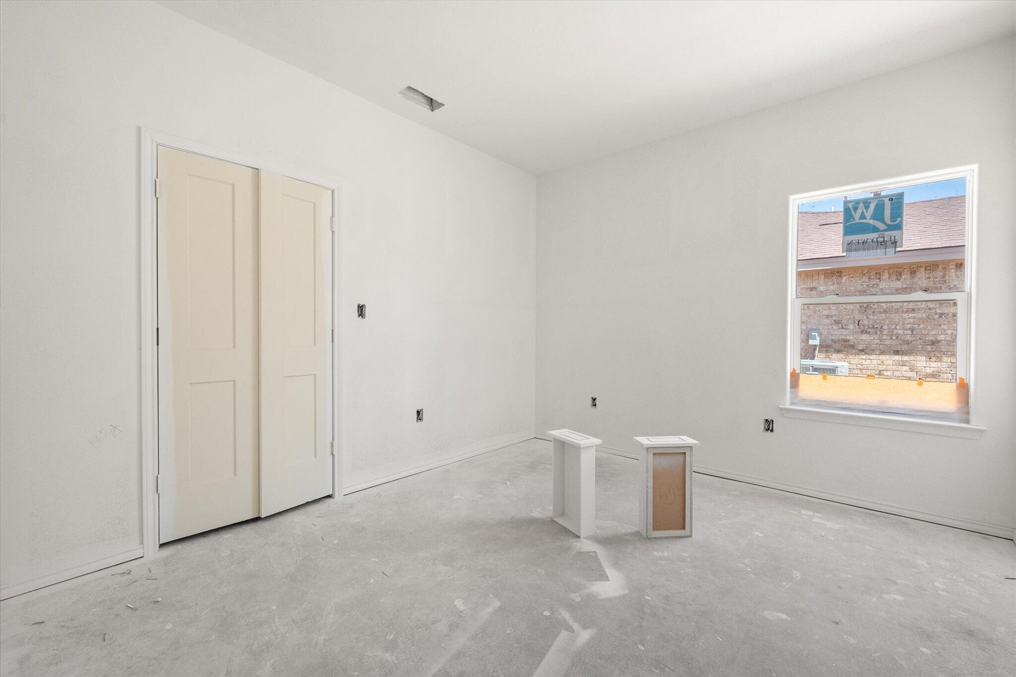 6412 38th Street Lubbock, TX 79407 - Photo 5 of 20 a view of an empty room with a window