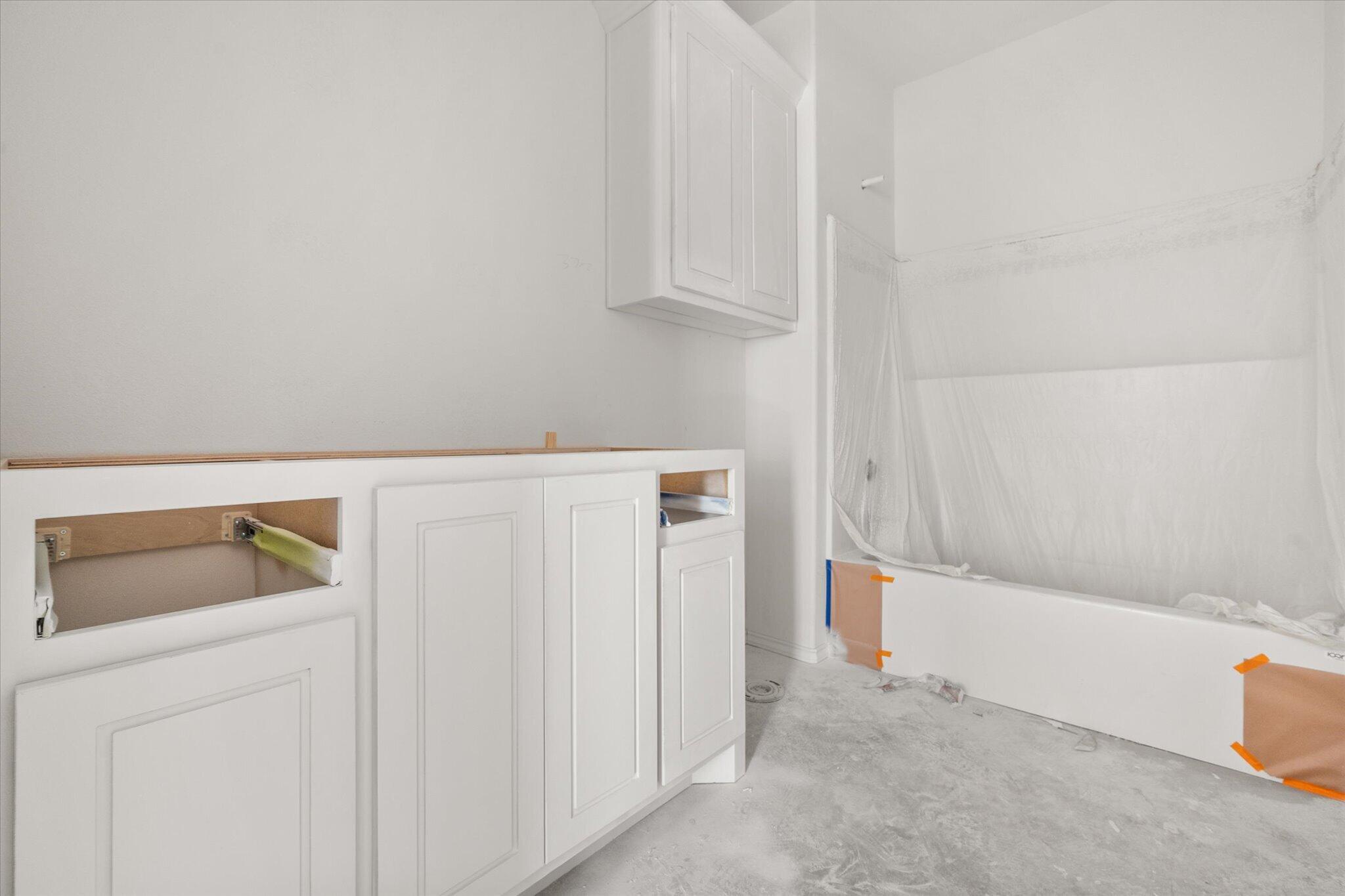 6412 38th Street Lubbock, TX 79407 - Photo 6 of 20 a bathroom with a sink and bathtub