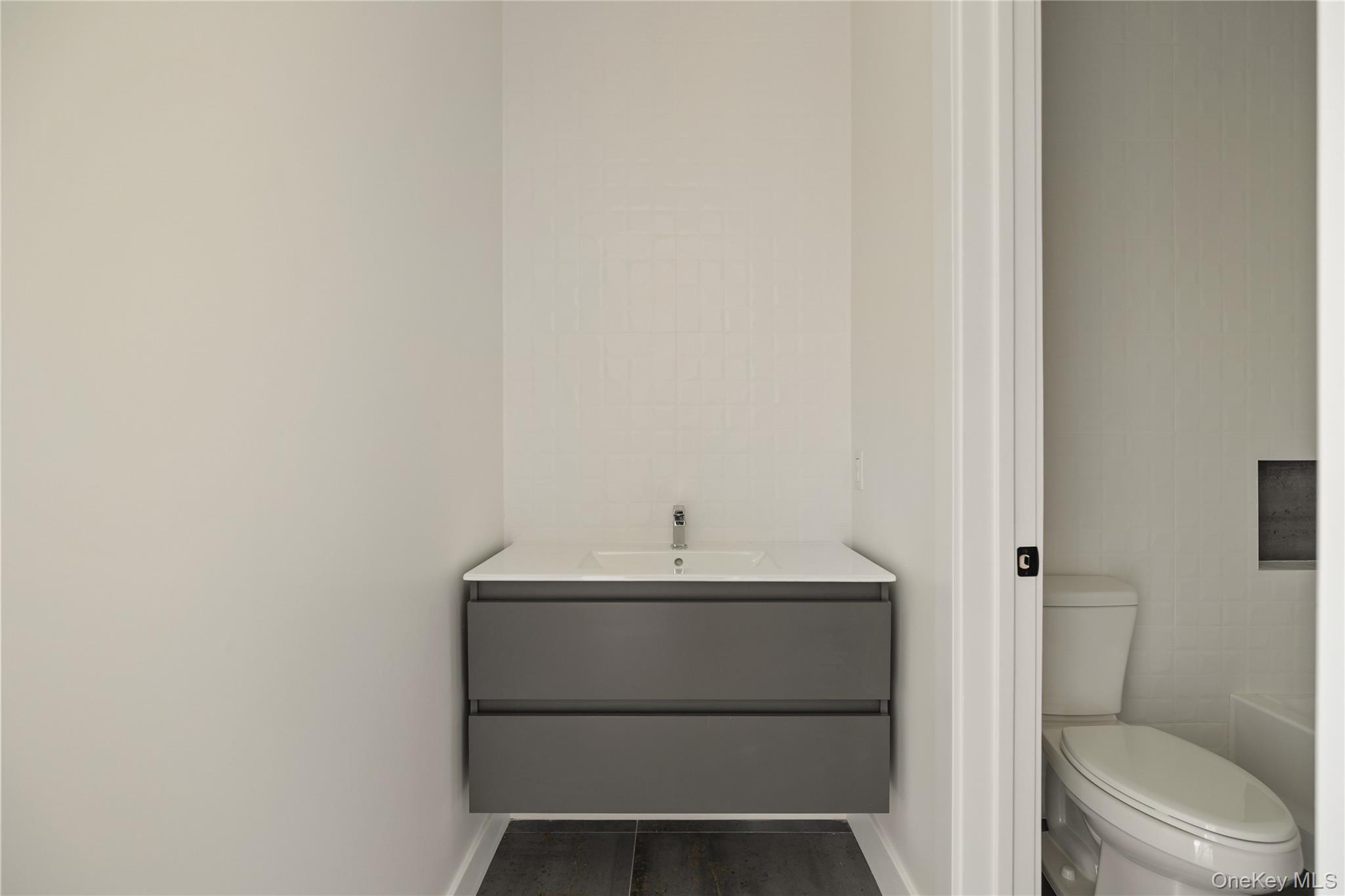 9 Valley Way, Unit 320 Spring Valley, NY 10977 - Photo 35 of 41 a bathroom with a sink and a toilet