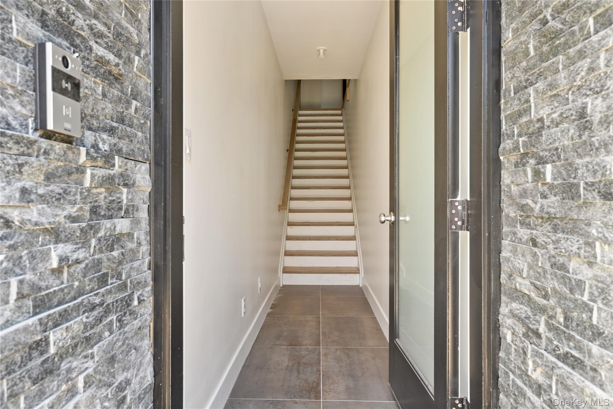 9 Valley Way, Unit 320 Spring Valley, NY 10977 - Photo 5 of 41 a view of a hallway with windows and stairs