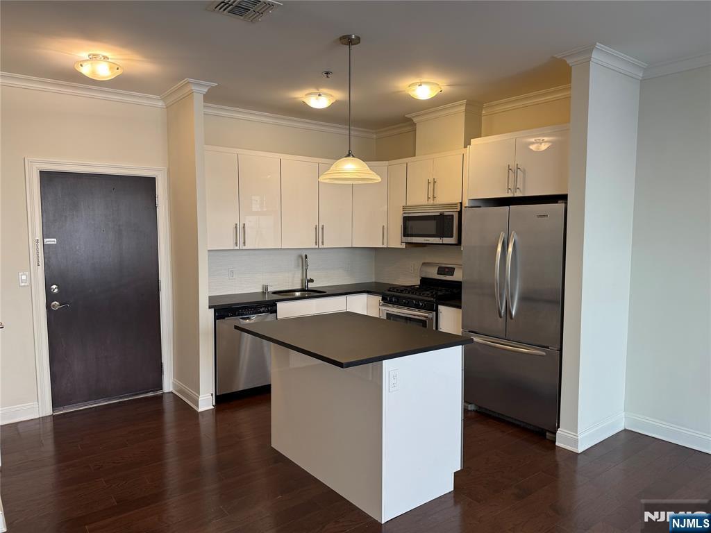 2001 Hudson Terrace, Unit 302 Fort Lee, NJ 07024 - Photo 3 of 16 a kitchen with stainless steel appliances granite countertop a refrigerator a sink and a stove