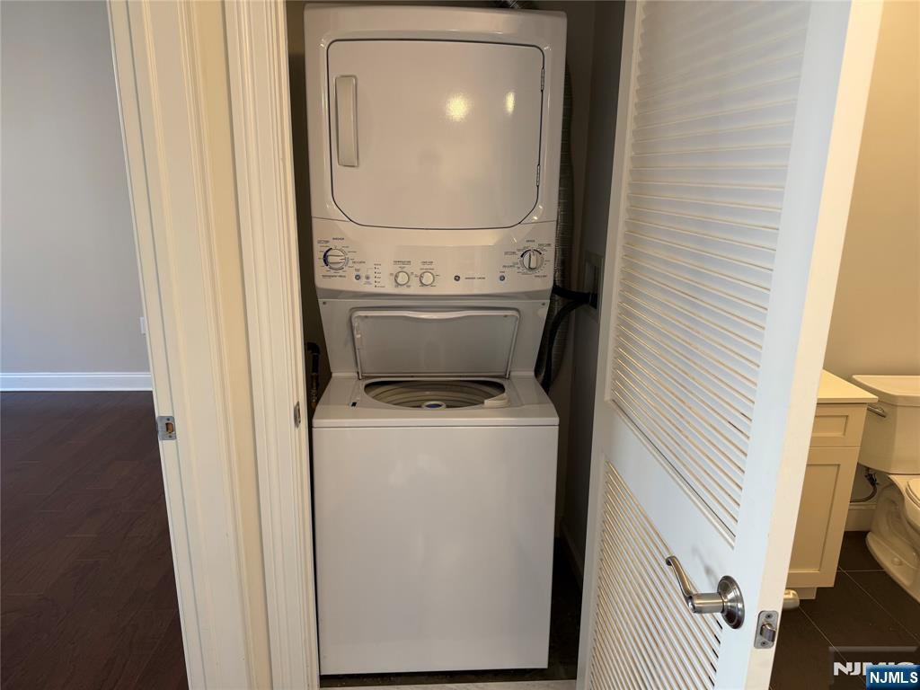 2001 Hudson Terrace, Unit 302 Fort Lee, NJ 07024 - Photo 9 of 16 a utility room with dryer and washer