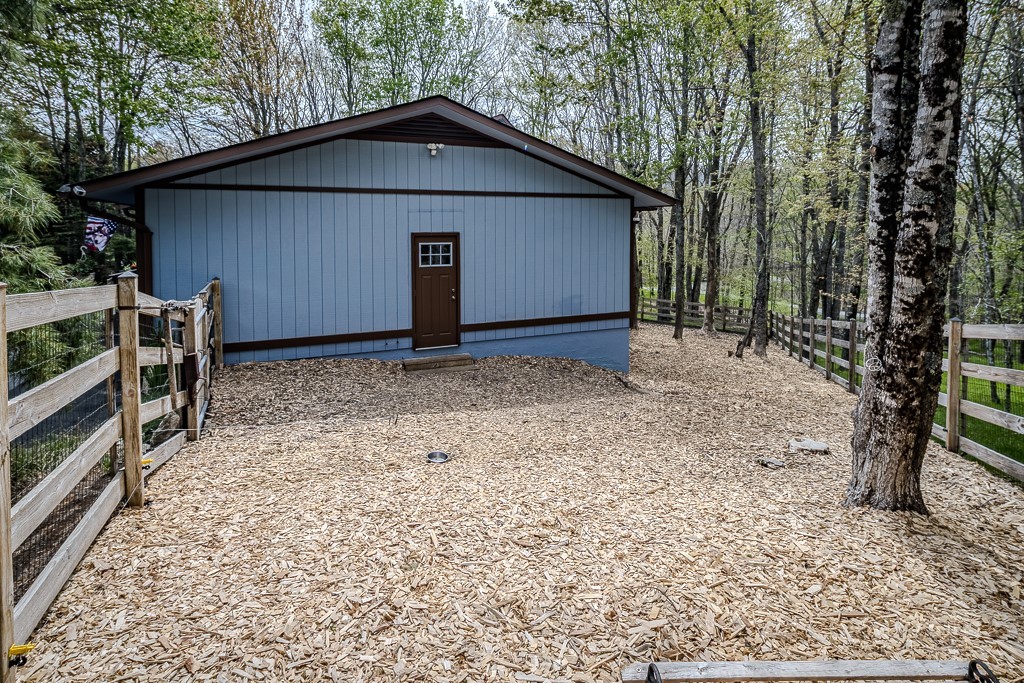 103-105 Upper Grouse Ridge Road Beech Mountain, NC 28604 - Photo 35 of 48 a view of a house with a yard