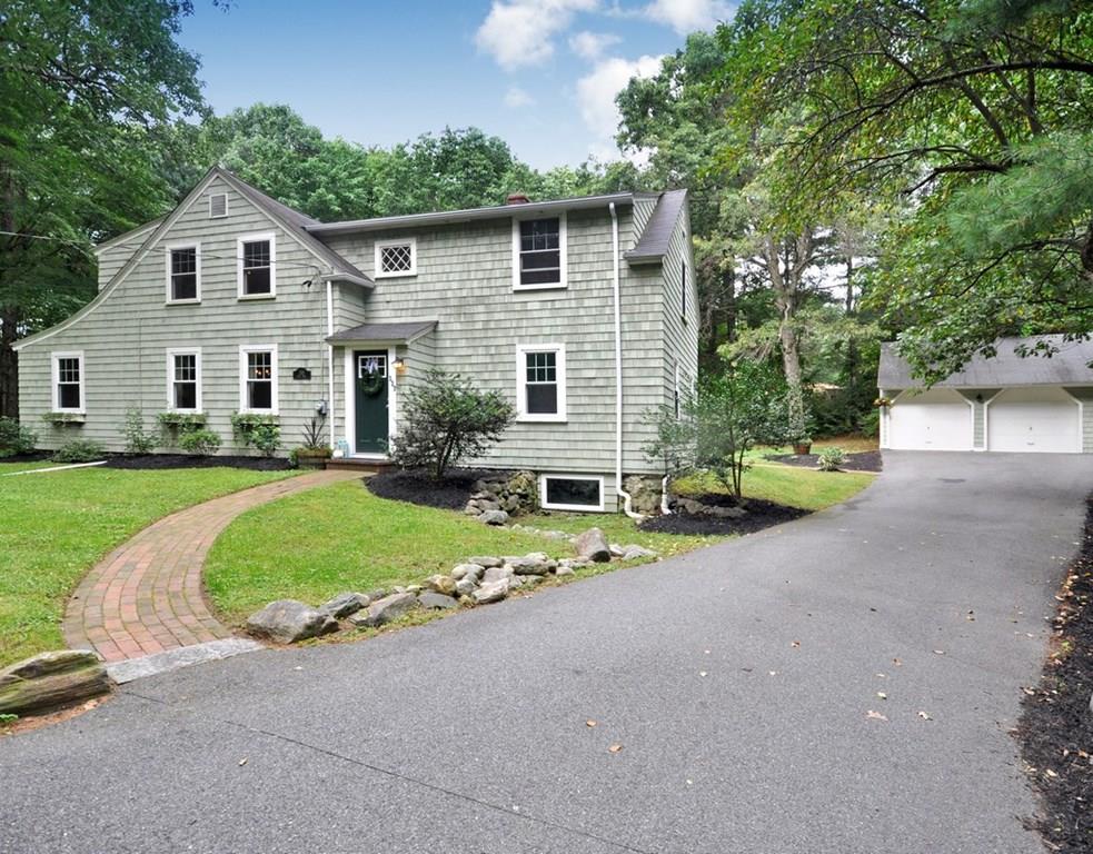 333 Depot Road Boxborough, MA 01719 - Photo 1 of 38 a front view of a house with a garden and plants