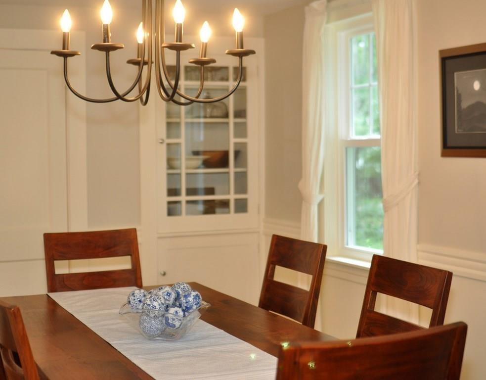 333 Depot Road Boxborough, MA 01719 - Photo 11 of 38 a view of a dining room with furniture window and wooden floor