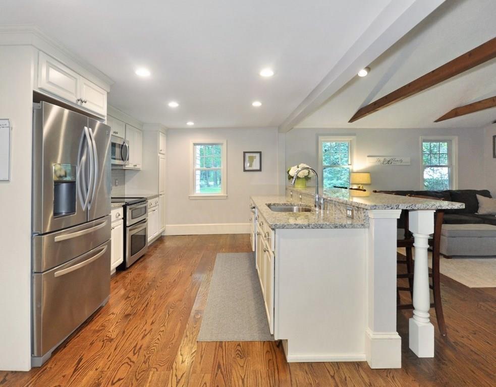 333 Depot Road Boxborough, MA 01719 - Photo 14 of 38 a kitchen with stainless steel appliances granite countertop a refrigerator a stove and a wooden floors
