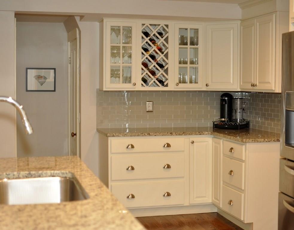 333 Depot Road Boxborough, MA 01719 - Photo 17 of 38 a kitchen with granite countertop a sink and a stove