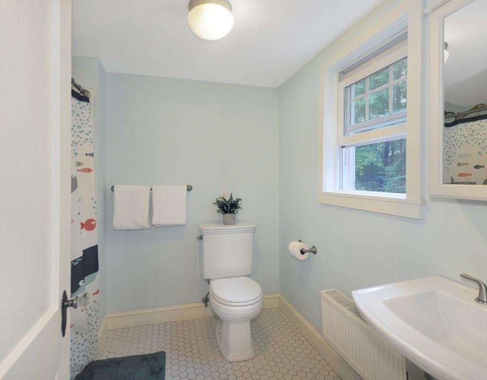 333 Depot Road Boxborough, MA 01719 - Photo 32 of 38 a bathroom with a toilet a sink and a bathtub