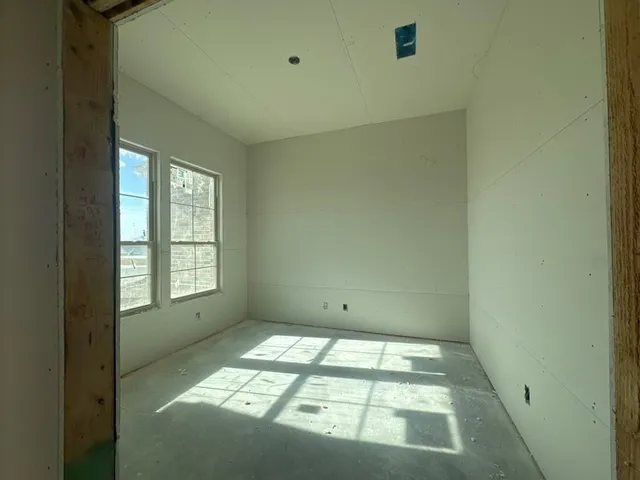a view of empty room with windows
