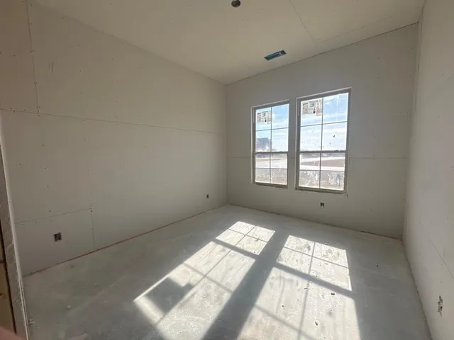 a view of an empty room and window