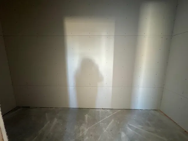 an empty room with a bench