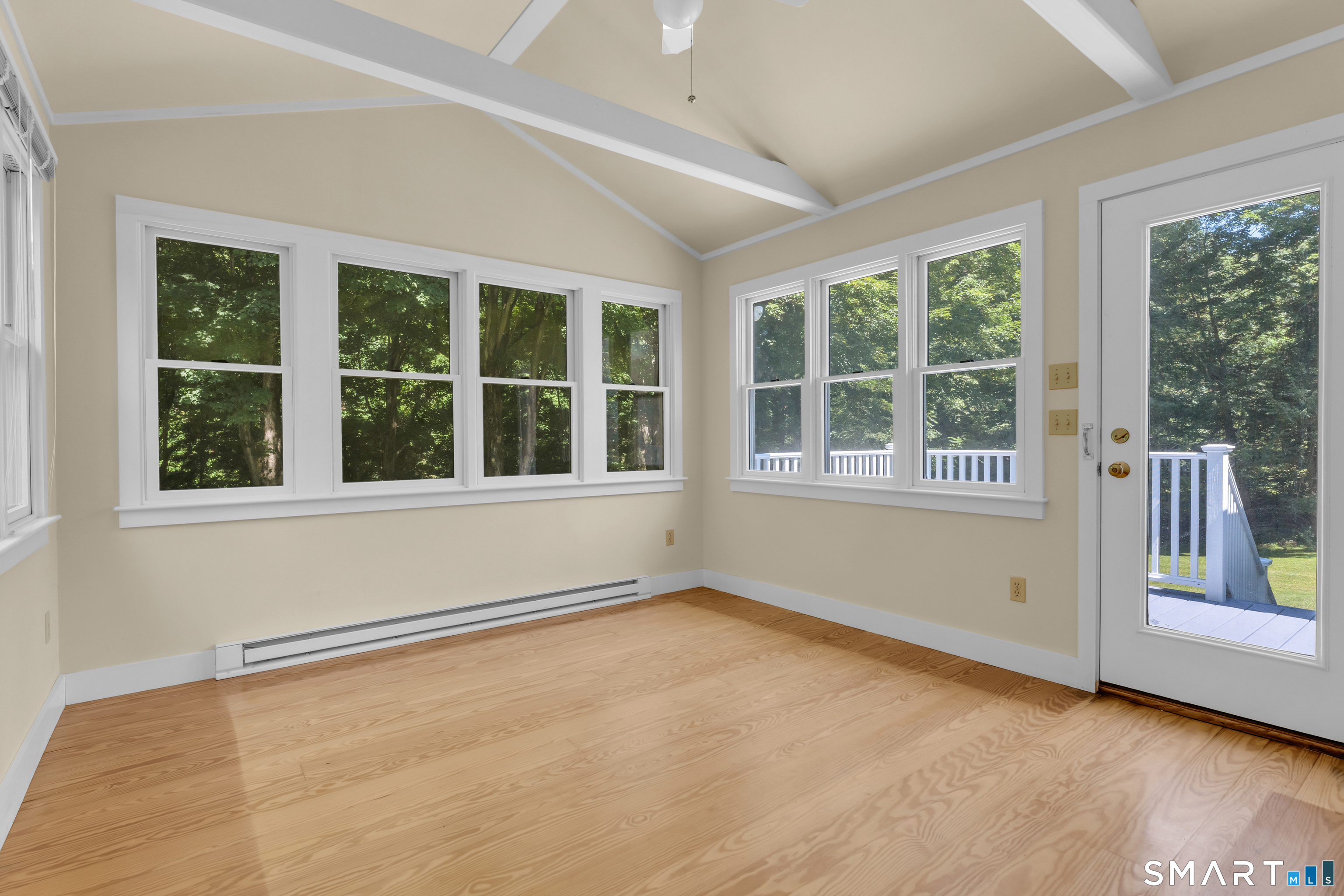 25 Goose Hill Road Chester, CT 06412 - Photo 4 of 24 The newer Sunroom with cathedral ceiling overlooks the private backyard.