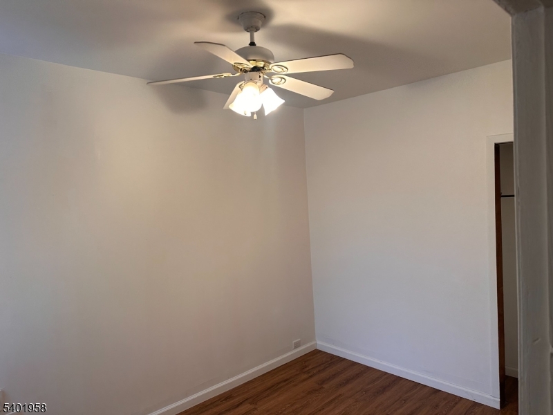 986 Madison Avenue Paterson, NJ 07501 - Photo 6 of 10 a view of a small space with wooden floor and a window