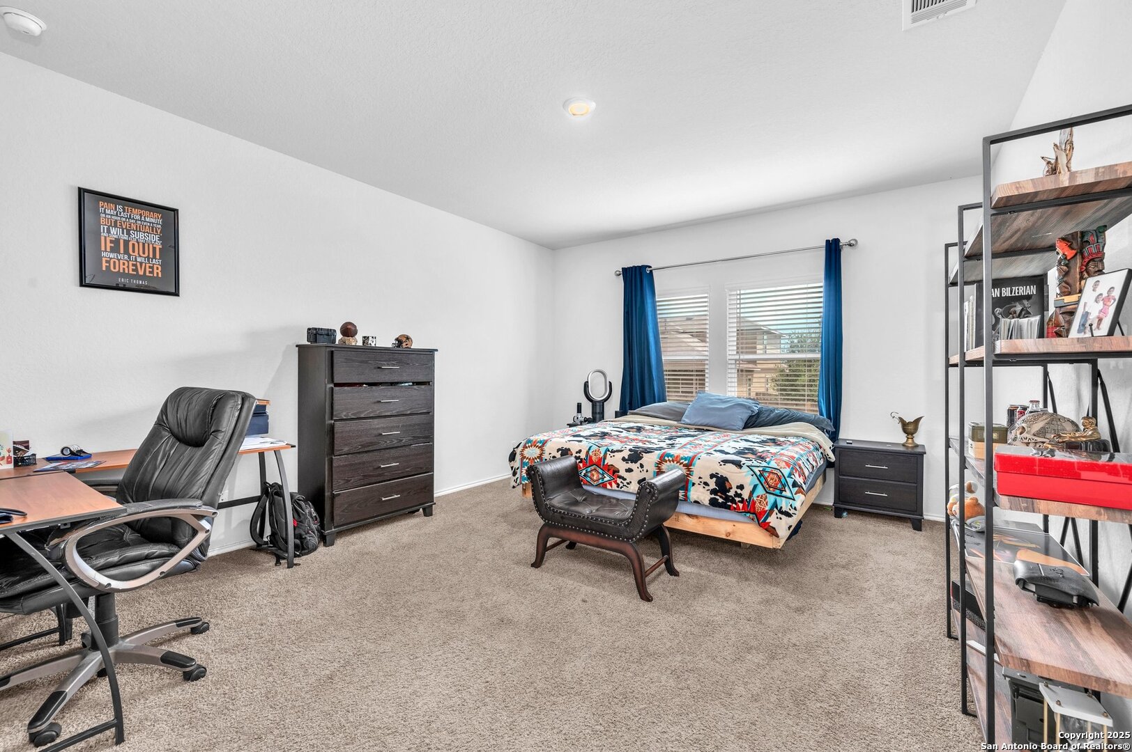 14016 Breccia Loop San Antonio, TX 78253 - Photo 12 of 31 a bedroom with a bed a dresser and book shelf
