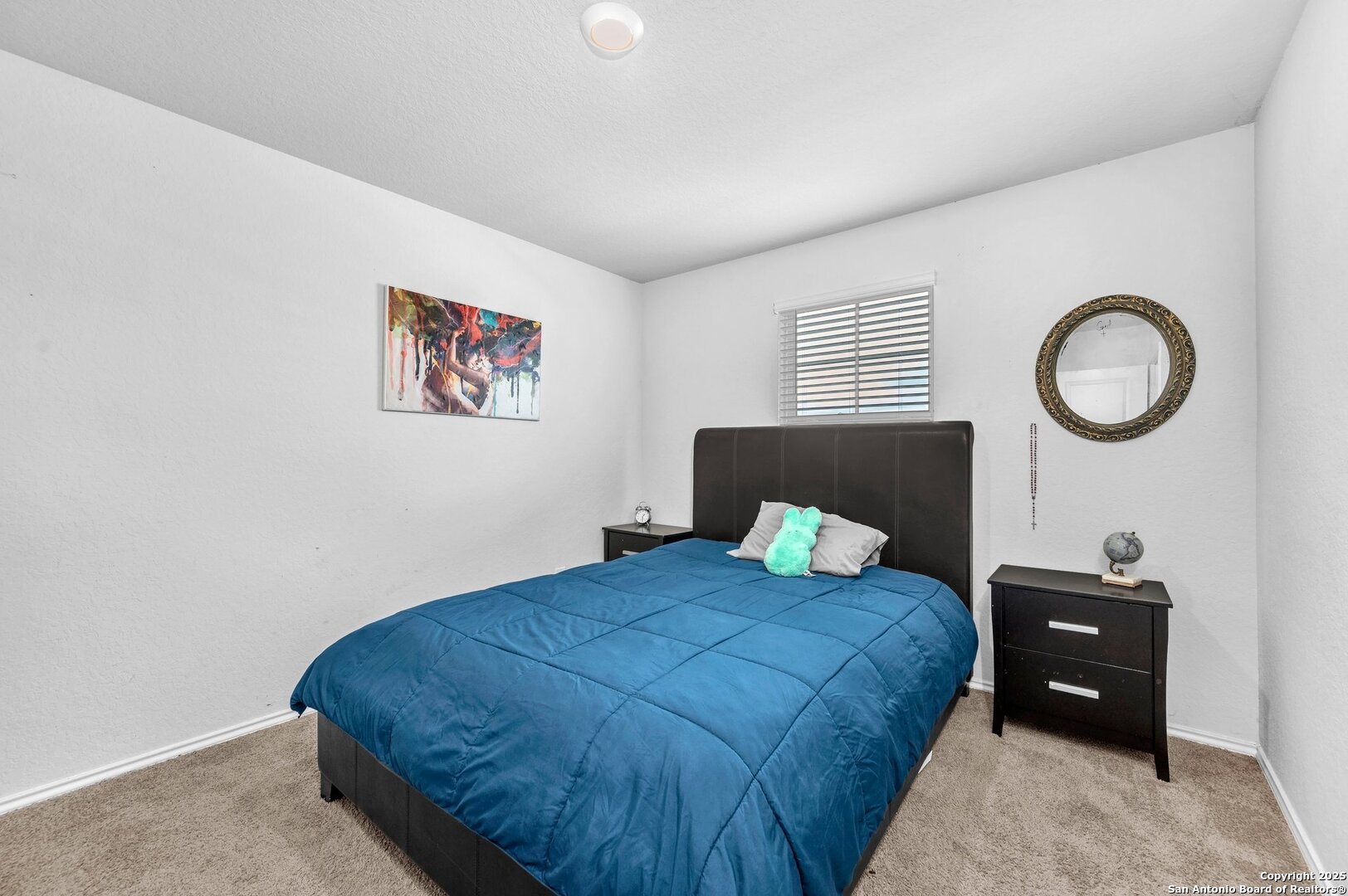 14016 Breccia Loop San Antonio, TX 78253 - Photo 22 of 31 a bedroom with a bed and a lamp on table