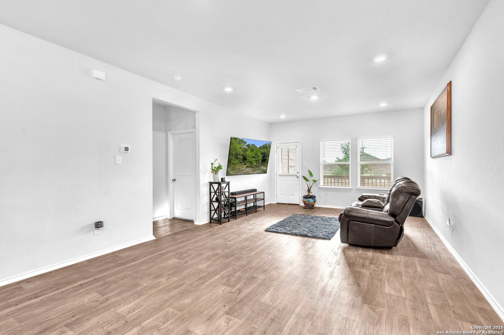14016 Breccia Loop San Antonio, TX 78253 - Photo 8 of 31 a living room with furniture and a flat screen tv