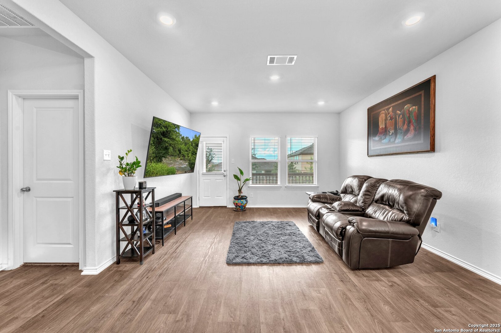 14016 Breccia Loop San Antonio, TX 78253 - Photo 9 of 31 a living room with furniture and a flat screen tv