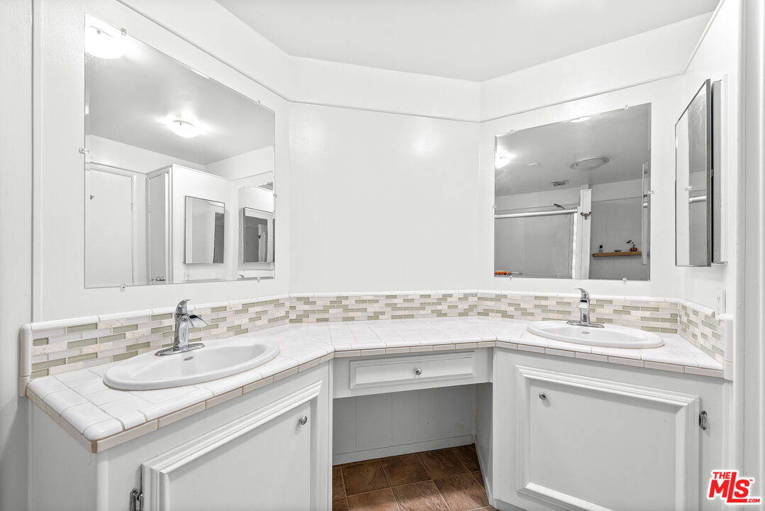 1205 Supi Topanga, CA 90290 - Photo 13 of 24 a bathroom with a sink and a mirror