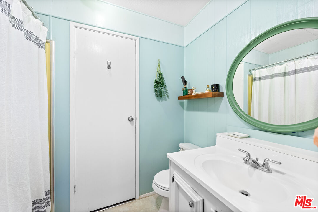 1205 Supi Topanga, CA 90290 - Photo 15 of 24 a bathroom with a sink toilet and a mirror
