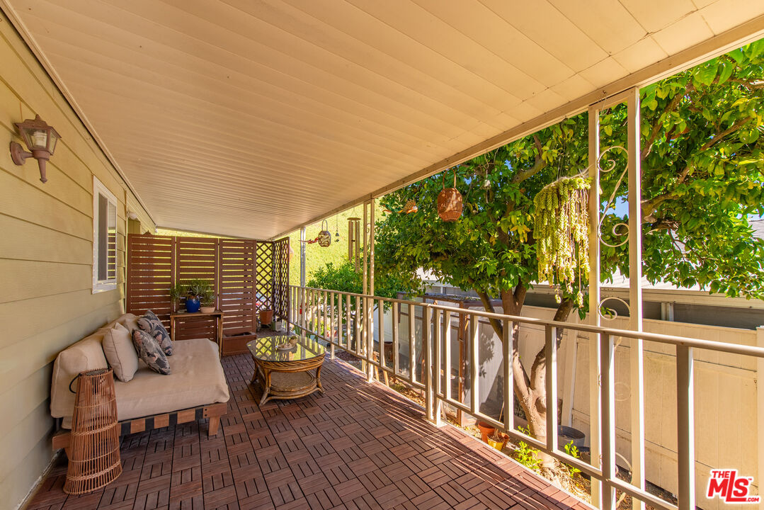 1205 Supi Topanga, CA 90290 - Photo 17 of 24 a balcony with wooden floor and furniture