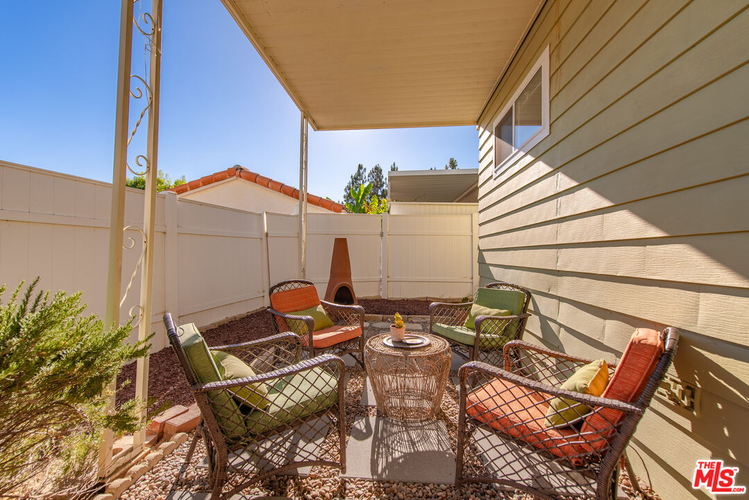 1205 Supi Topanga, CA 90290 - Photo 19 of 24 a backyard of a house with table and chairs