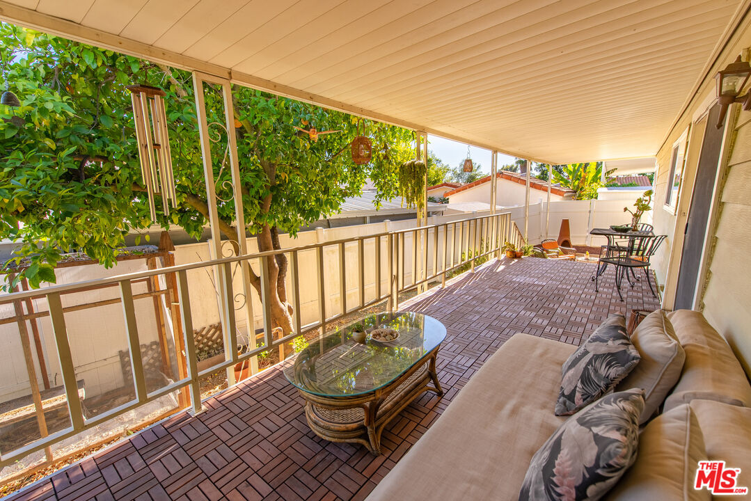 1205 Supi Topanga, CA 90290 - Photo 20 of 24 a view of a chair and tables in the balcony