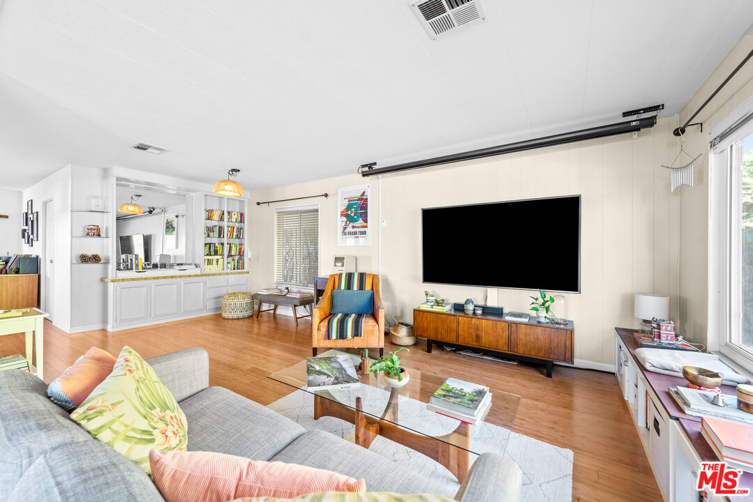 1205 Supi Topanga, CA 90290 - Photo 3 of 24 a living room with furniture and a flat screen tv