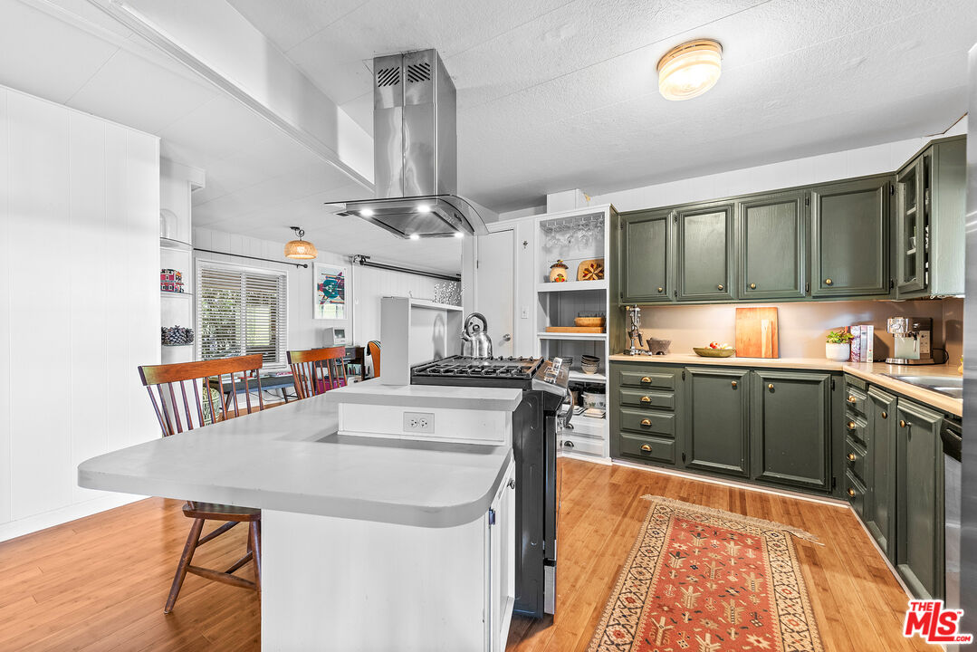 1205 Supi Topanga, CA 90290 - Photo 5 of 24 a kitchen with stainless steel appliances granite countertop a sink and cabinets