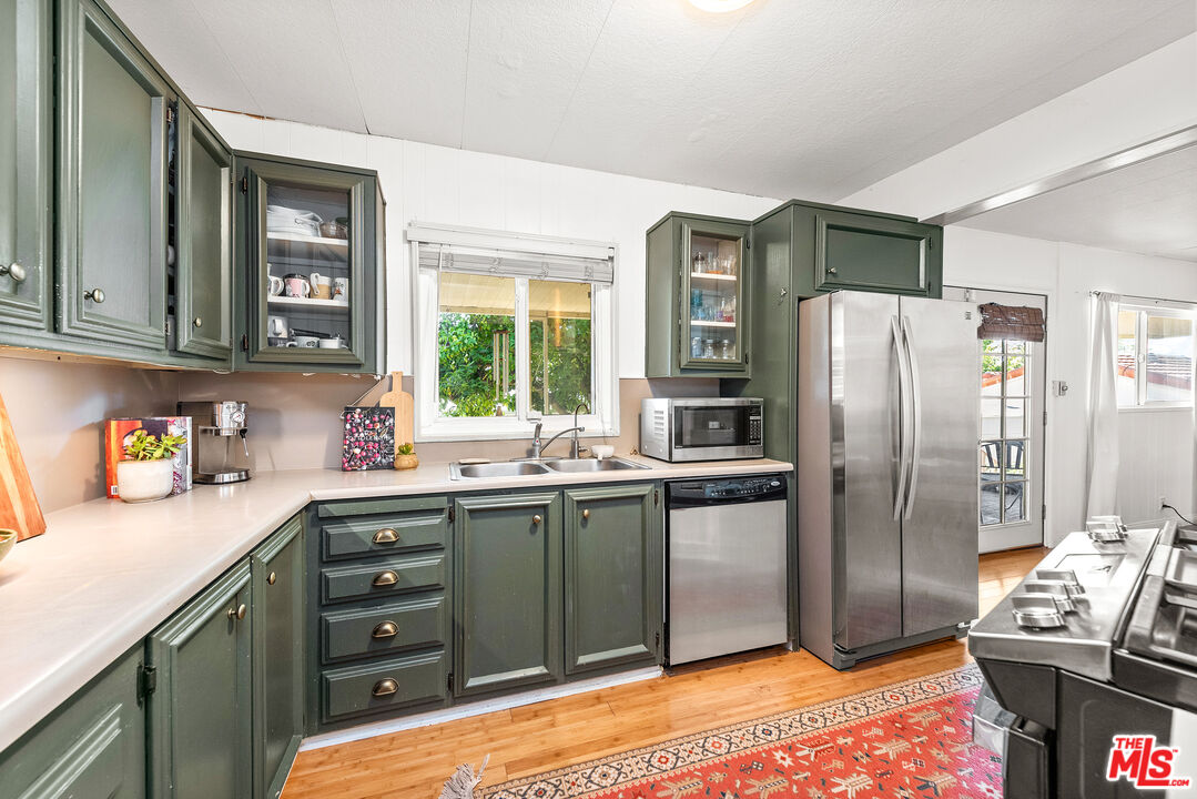 1205 Supi Topanga, CA 90290 - Photo 6 of 24 a kitchen with stainless steel appliances granite countertop a refrigerator and a sink
