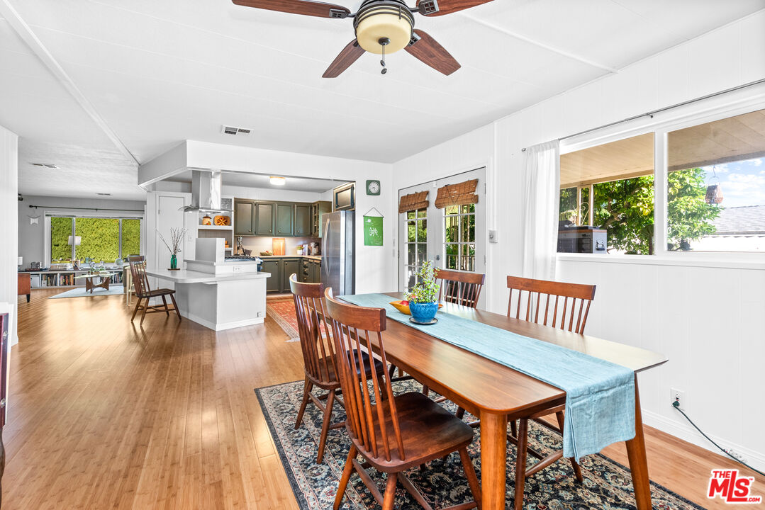 1205 Supi Topanga, CA 90290 - Photo 9 of 24 a view of a dining room with furniture window and wooden floor
