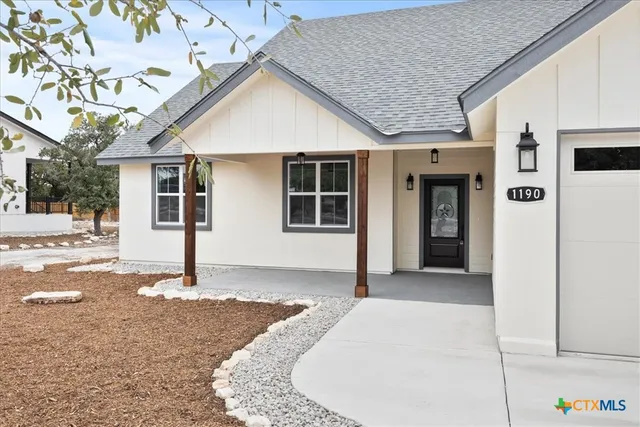 a front view of a house with a garage