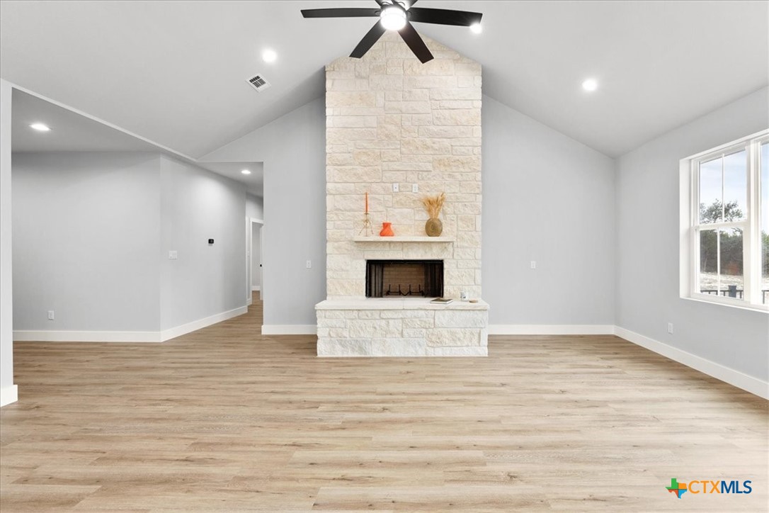 1190 Fernwood Road Fischer, TX 78623 - Photo 11 of 27 an empty room with wooden floor and windows