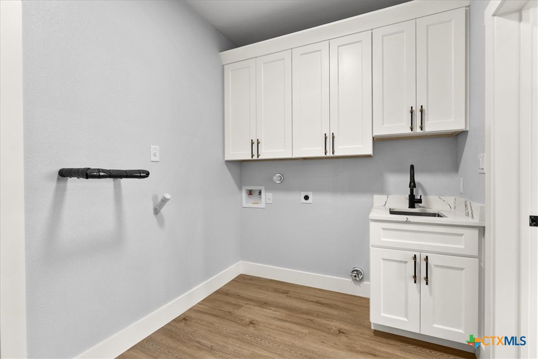 1190 Fernwood Road Fischer, TX 78623 - Photo 18 of 27 a view of cabinets and wooden floor