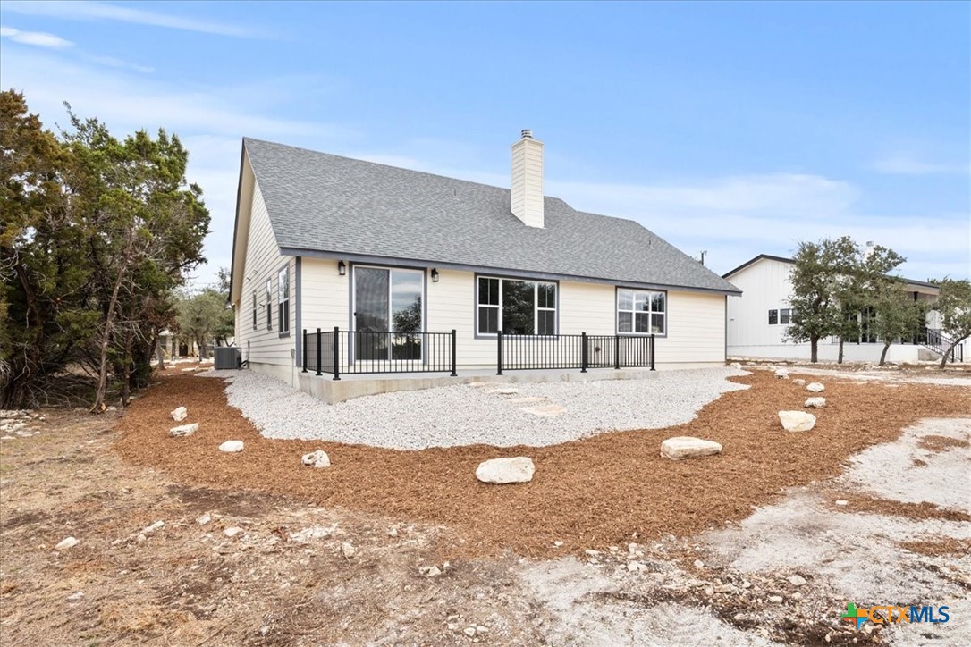 1190 Fernwood Road Fischer, TX 78623 - Photo 7 of 27 a view of a house with a park