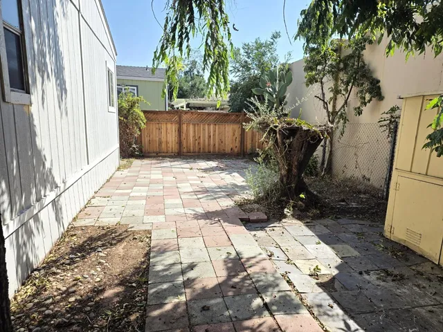 a view of a pathway with a yard