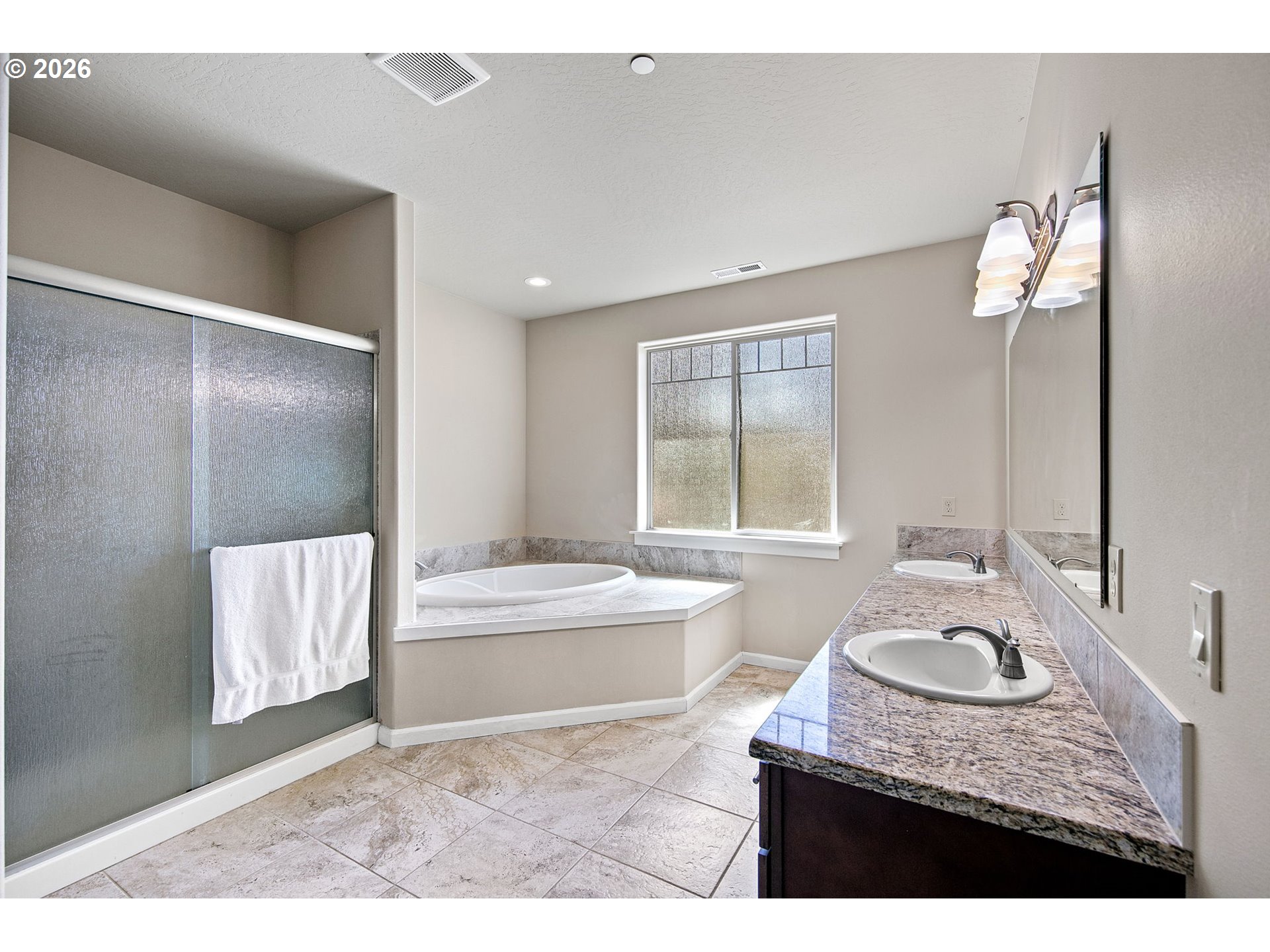 6451 Dogwood Street Springfield, OR 97478 - Photo 20 of 38 a bathroom with a sink double vanity mirror and bathtub