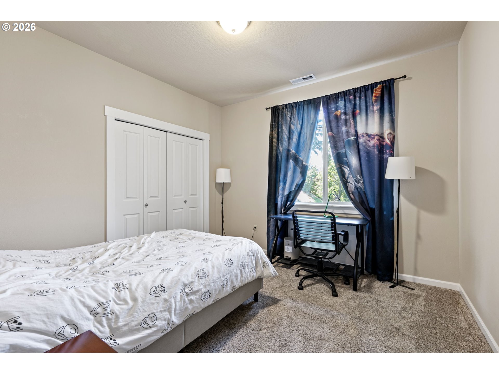 6451 Dogwood Street Springfield, OR 97478 - Photo 24 of 38 a bedroom with a bed and a window